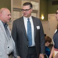 winner and wife talk with friend